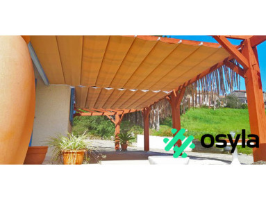Pergola coulissante Mexico fixation de mur à mur avec toile rétractable et lambrequin